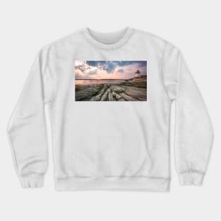 Lighthouse on a rocky beach Crewneck Sweatshirt